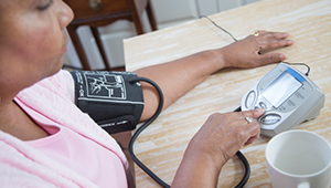 BP-Check_woman-checking-blood-pressure-monitor_1col.jpg