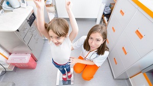 Blog-pediatric-back-girl-nurse-scale-weigh-1_column.jpg