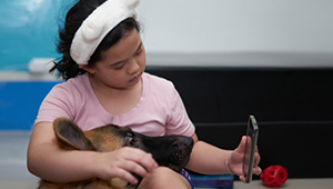 Animal-care-giver_service-dog_with-patient_1col.jpg
